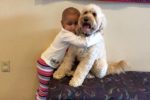 Sophia hugging Mogie, 2016